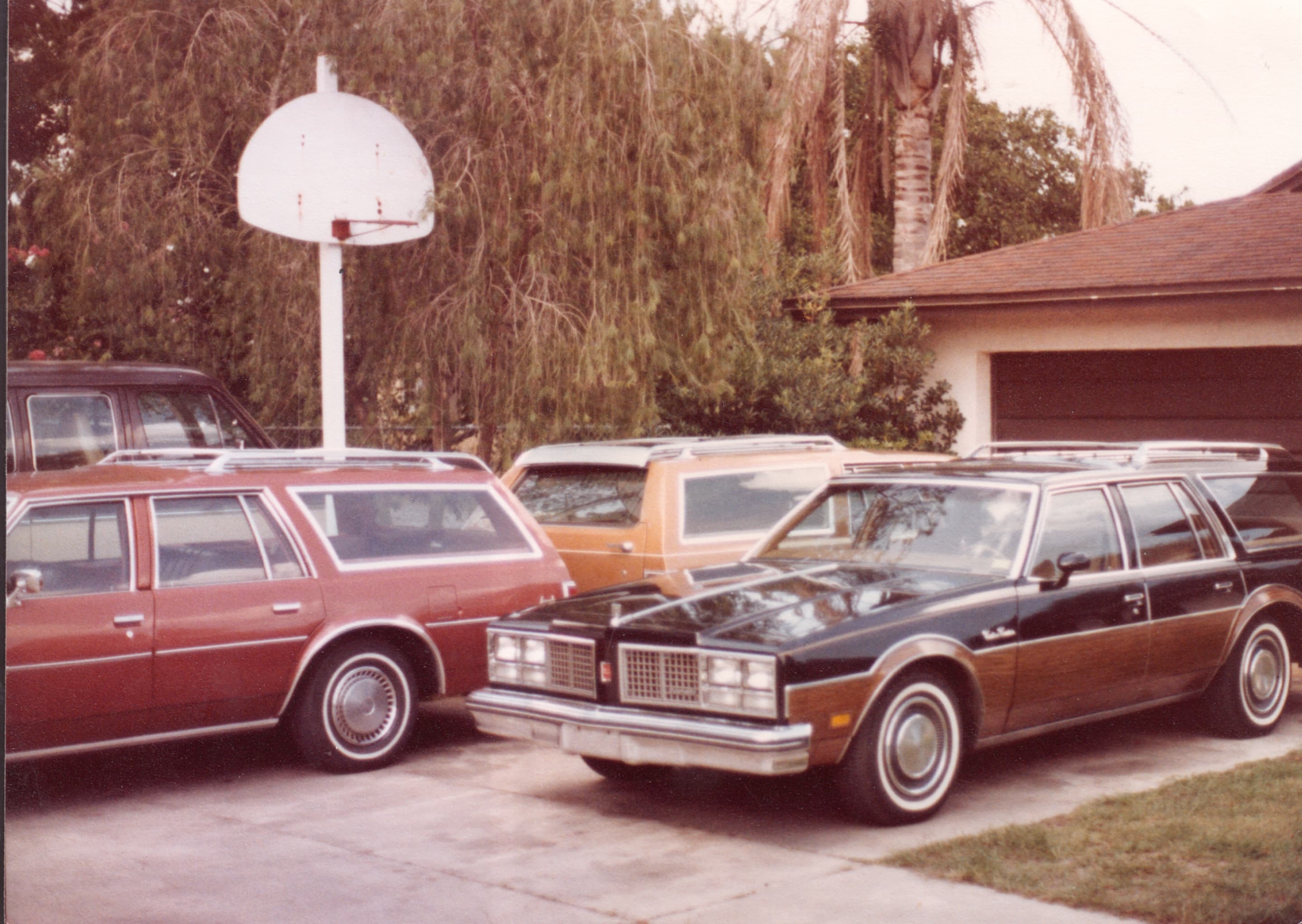 The first vehicles — station wagons used for early group transport in Orlando.