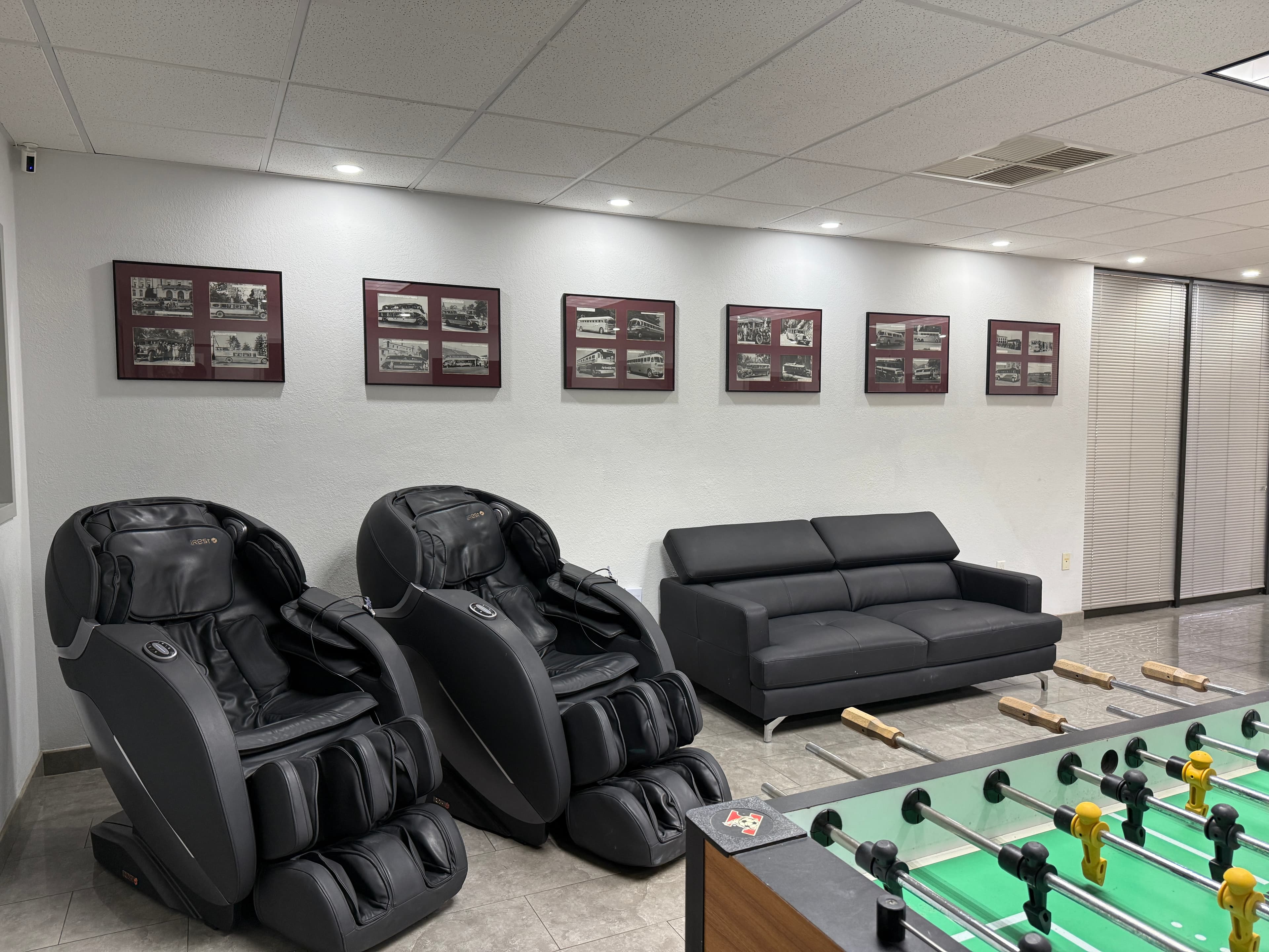 Game room lounge with massage chairs and vintage motorcoach bus photography
