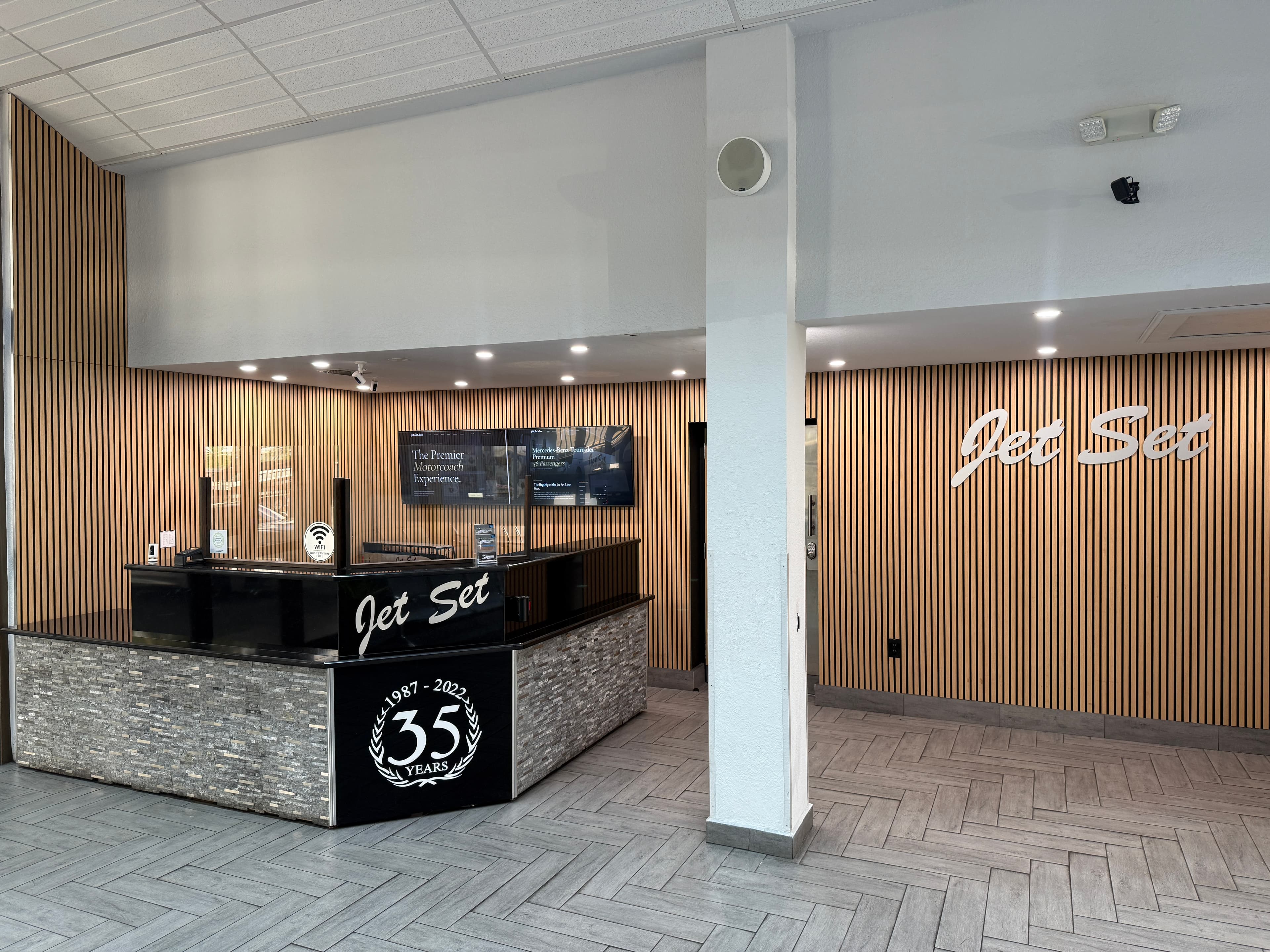 Jet Set terminal check-in counter with 35-year anniversary branding